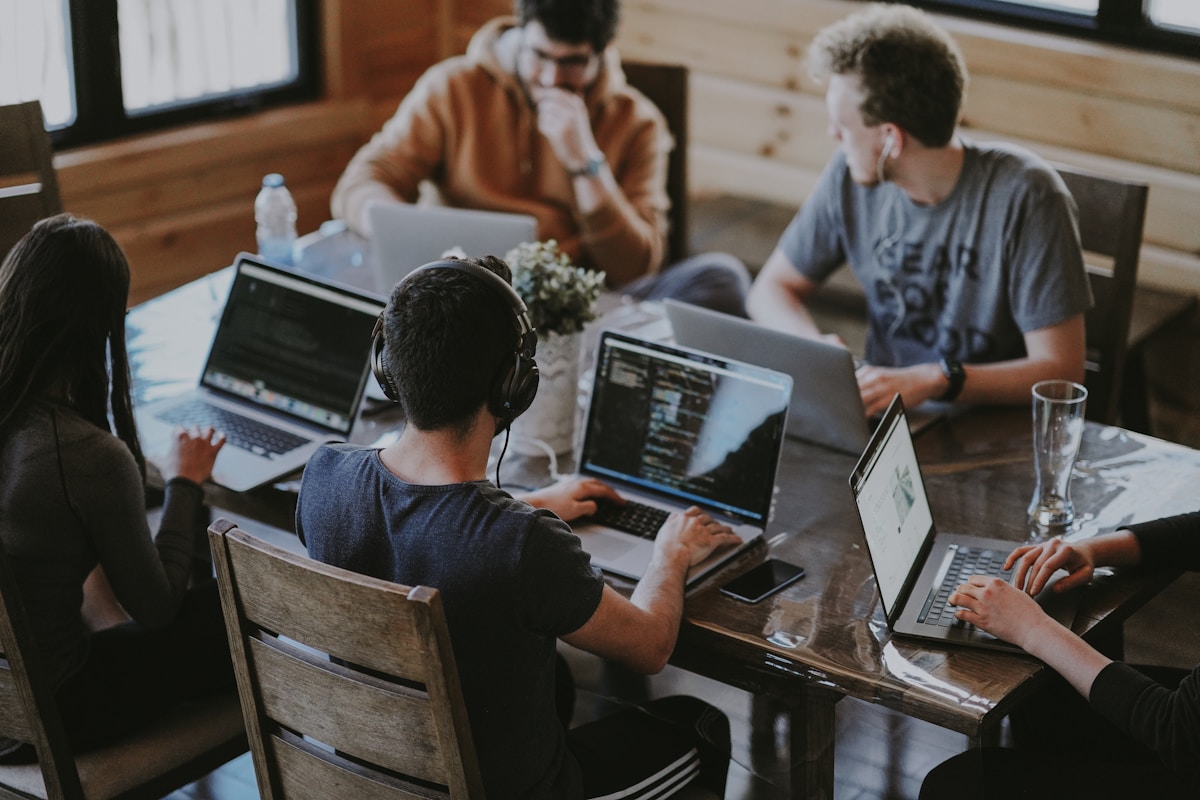 Team collaborating — balance between people, ideas, and technology