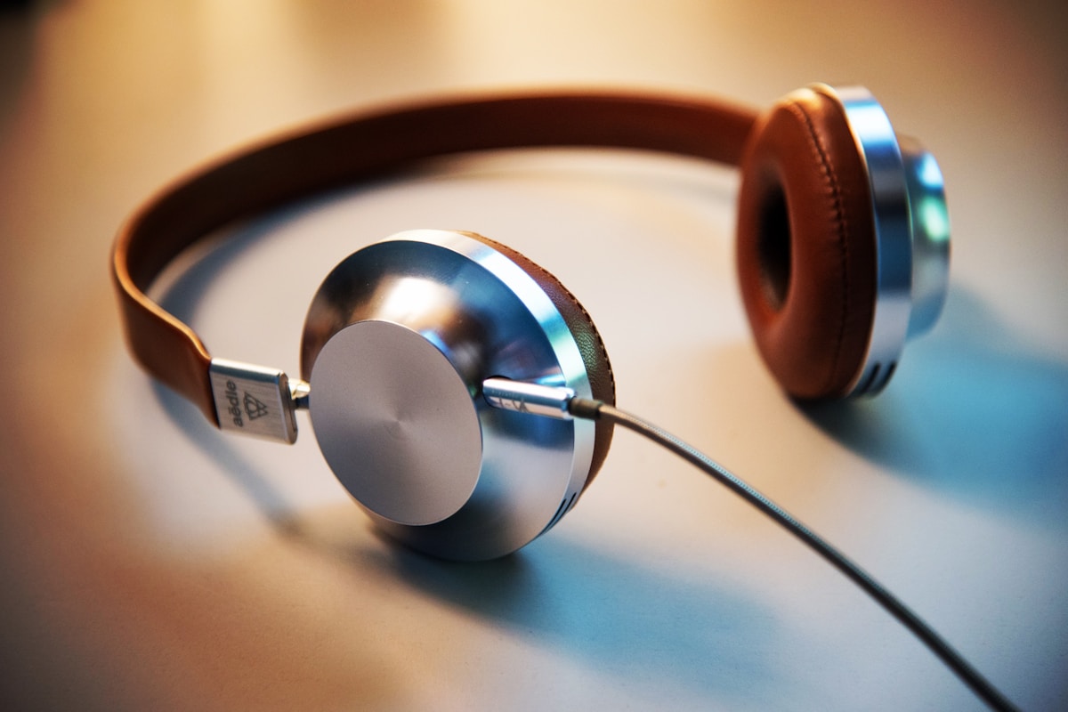 Person enjoying audio with headphones — learning on the go